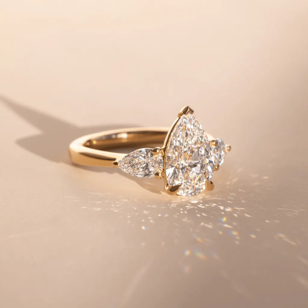 Elara 2 Carat Lab-Grown Pear Diamond Three-Stone Engagement Ring in Yellow Gold
